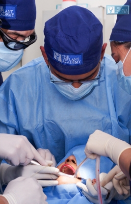 Close-up of dental implant fixture being placed in jawbone