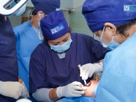 Dental implant surgery moment captured during training workshop